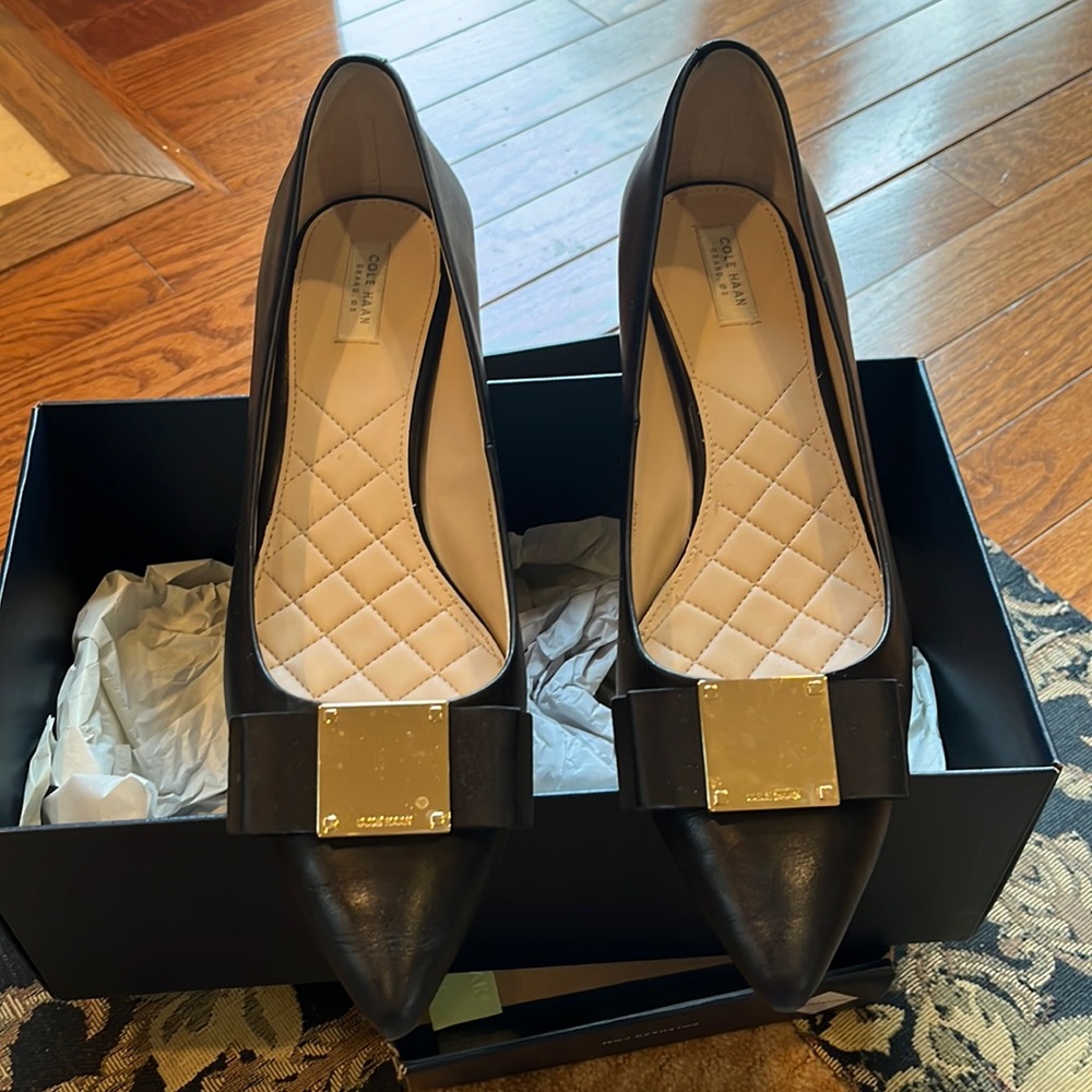 Black Cole Haan pumps. 1.5” heel. Waterproof!! Worn once. Size 8.